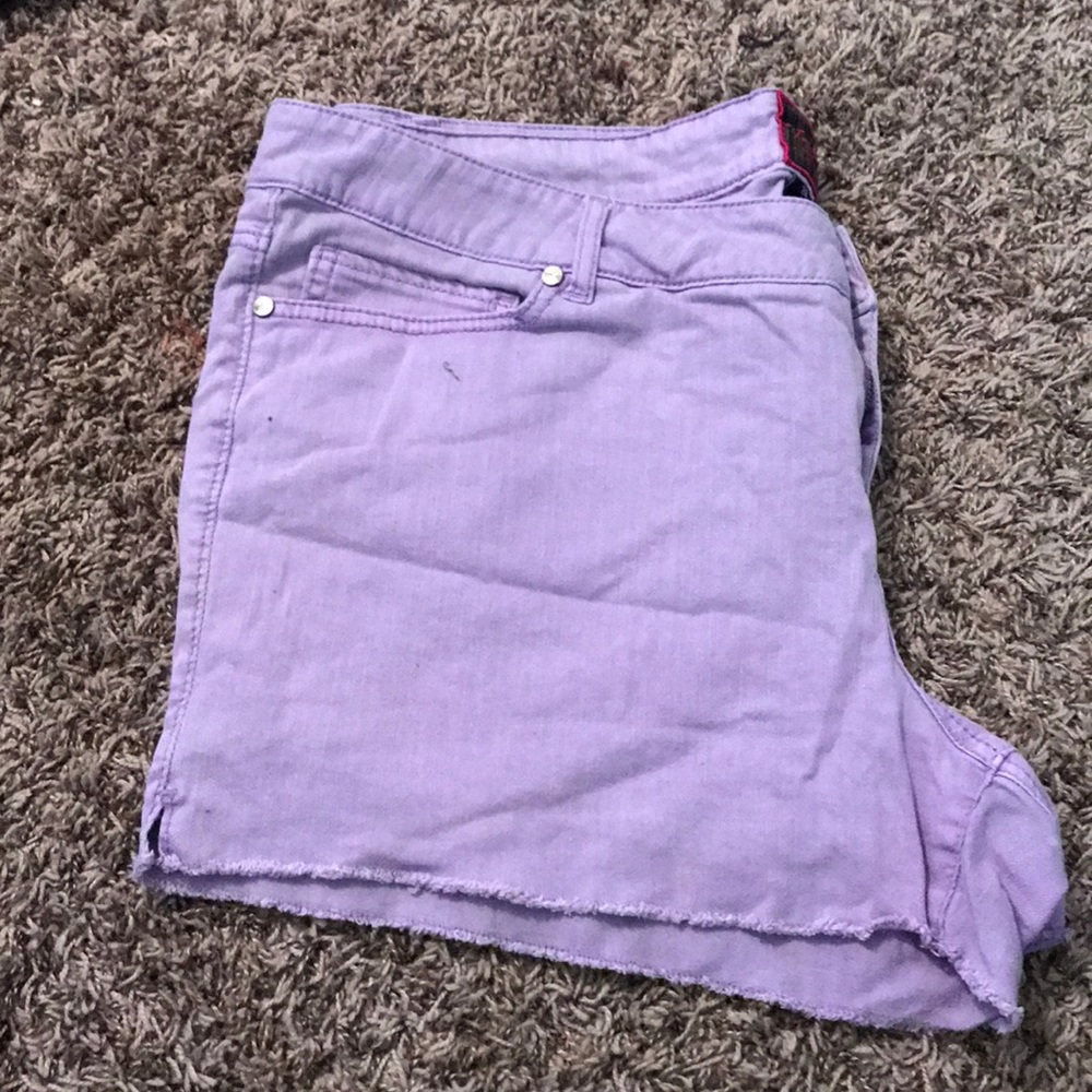 Light purple denim shorts.